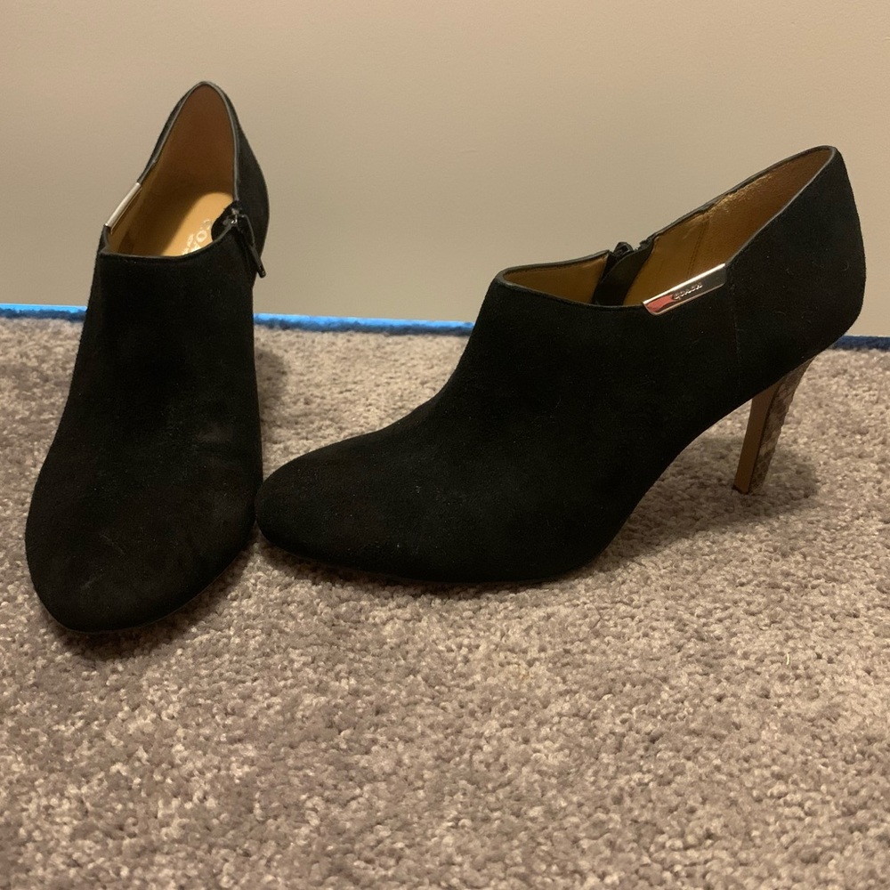 Black Coach shoe with snakeskin heel